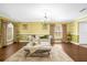 Spacious living room featuring hardwood floors and a cozy seating area at 11407 Bentry St, Orlando, FL 32824