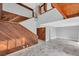 Open living area with high ceilings and wood-paneled accent wall at 1502 Ne Buckeye Ne Rd # 2, Winter Haven, FL 33881