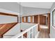Bright hallway with wood-paneled walls and wood floors at 1502 Ne Buckeye Ne Rd # 2, Winter Haven, FL 33881
