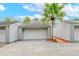 Attached garage with a pathway to the unit entrance at 1502 Ne Buckeye Ne Rd # 2, Winter Haven, FL 33881