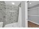 Updated bathroom with marble-look shower surround at 1502 Ne Buckeye Ne Rd # 2, Winter Haven, FL 33881