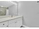 Clean bathroom with white vanity and a shower/tub combo at 1502 Ne Buckeye Ne Rd # 2, Winter Haven, FL 33881