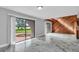 Living room with sliding glass doors and view of backyard at 1502 Ne Buckeye Ne Rd # 2, Winter Haven, FL 33881