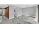 Living room with marble floors and access to patio and hallway at 1502 Ne Buckeye Ne Rd # 2, Winter Haven, FL 33881