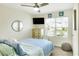 Bedroom with window, dresser, and a comfy bed at 2638 Galway Grove Way, Lakeland, FL 33811