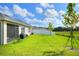 Large backyard with grassy area and privacy fence at 2638 Galway Grove Way, Lakeland, FL 33811