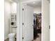 Main bathroom with toilet and access to a walk-in closet at 2638 Galway Grove Way, Lakeland, FL 33811
