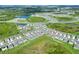 Aerial view showcasing home's location in a community near a lake at 2638 Galway Grove Way, Lakeland, FL 33811
