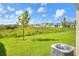 View of a spacious backyard and surrounding landscape at 2638 Galway Grove Way, Lakeland, FL 33811