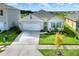 Single-story home with a two-car garage and well-manicured lawn at 2638 Galway Grove Way, Lakeland, FL 33811