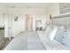 Main bedroom with king bed, en-suite bathroom access, and ample natural light at 2638 Galway Grove Way, Lakeland, FL 33811
