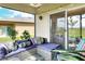 Relaxing screened patio with comfy seating and string lights at 2638 Galway Grove Way, Lakeland, FL 33811