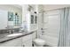 Clean bathroom with tub, shower, and granite countertop at 2638 Galway Grove Way, Lakeland, FL 33811