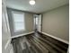 Bright bedroom featuring vinyl flooring and an ensuite bathroom at 2808 Fletcher Ave, Lakeland, FL 33803