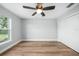 Bright bedroom with hardwood floors and double door closet at 1835 S Lake Reedy Blvd, Frostproof, FL 33843