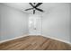 Spacious bedroom with wood-look flooring and double doors leading to an ensuite bathroom at 1835 S Lake Reedy Blvd, Frostproof, FL 33843