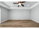 Simple bedroom with wood-look flooring and neutral-colored walls at 1835 S Lake Reedy Blvd, Frostproof, FL 33843