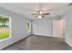 Well-lit bedroom with wood-look floors and ceiling fan at 6319 Nw 67 Ter, Ocala, FL 34482