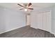 Spacious bedroom with ceiling fan and large closet at 6319 Nw 67 Ter, Ocala, FL 34482