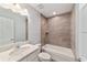 Bathroom with white vanity, tile tub surround, and toilet at 6319 Nw 67 Ter, Ocala, FL 34482