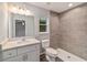 Modern bathroom with white vanity and tile shower at 6319 Nw 67 Ter, Ocala, FL 34482