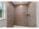 Large tiled shower with built-in shelf at 6319 Nw 67 Ter, Ocala, FL 34482