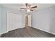 Bedroom with double door closet and wood-look floors at 6319 Nw 67 Ter, Ocala, FL 34482