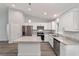 Modern kitchen with white cabinets, granite counters, and stainless steel appliances at 6319 Nw 67 Ter, Ocala, FL 34482