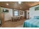 Bedroom with a queen bed, wooden table, and chest of drawers at 4292 Sw 73Rd Trl, Bushnell, FL 33513