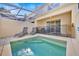 Private screened pool with patio furniture and lush greenery at 17531 Placidity Ave, Clermont, FL 34714