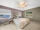 Main bedroom with a large bed and neutral decor at 5337 Jacob Ave, Polk City, FL 33868