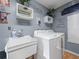 Bright laundry room with washer, dryer, and utility sink at 5337 Jacob Ave, Polk City, FL 33868