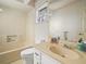 Bathroom with a tub, toilet, and sink at 5337 Jacob Ave, Polk City, FL 33868