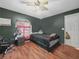 Cozy bedroom with wood floors and a ceiling fan at 5337 Jacob Ave, Polk City, FL 33868