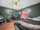 Bright bedroom with wood floors, a desk, and ample natural light at 5337 Jacob Ave, Polk City, FL 33868