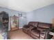 Basement with a brown leather couch and display case at 5337 Jacob Ave, Polk City, FL 33868