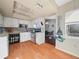 Bright kitchen with white cabinets and wood flooring at 5337 Jacob Ave, Polk City, FL 33868