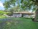 Large backyard with a screened patio and spacious lawn at 5337 Jacob Ave, Polk City, FL 33868