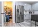 Kitchen with stainless steel refrigerator and pantry at 7036 Mapperton Dr, Windermere, FL 34786