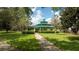 Community gazebo with seating, surrounded by lush landscaping at 7036 Mapperton Dr, Windermere, FL 34786