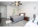 Bright bedroom with a queen bed, en-suite bathroom access, and ceiling fan at 7036 Mapperton Dr, Windermere, FL 34786