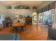 Bright dining room with wood flooring and a round dining table at 24502 Parlange Ct, Leesburg, FL 34748