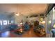 Vaulted ceiling living room with hardwood floors and comfy seating at 24502 Parlange Ct, Leesburg, FL 34748