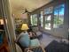 Sunroom with seating area, ceiling fan and access to backyard at 24502 Parlange Ct, Leesburg, FL 34748