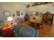 Bright dining room with wood flooring and a round dining table at 24502 Parlange Ct, Leesburg, FL 34748