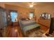 Spacious bedroom with king-size bed and ample closet space at 24502 Parlange Ct, Leesburg, FL 34748