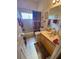 Well-maintained bathroom with tub/shower and wood vanity at 24502 Parlange Ct, Leesburg, FL 34748