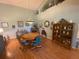Bright dining room with wood flooring and a round dining table at 24502 Parlange Ct, Leesburg, FL 34748