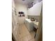 Laundry room with washer, dryer, and extra storage at 24502 Parlange Ct, Leesburg, FL 34748