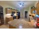 Kitchen boasts granite countertops and ample cabinetry at 24502 Parlange Ct, Leesburg, FL 34748